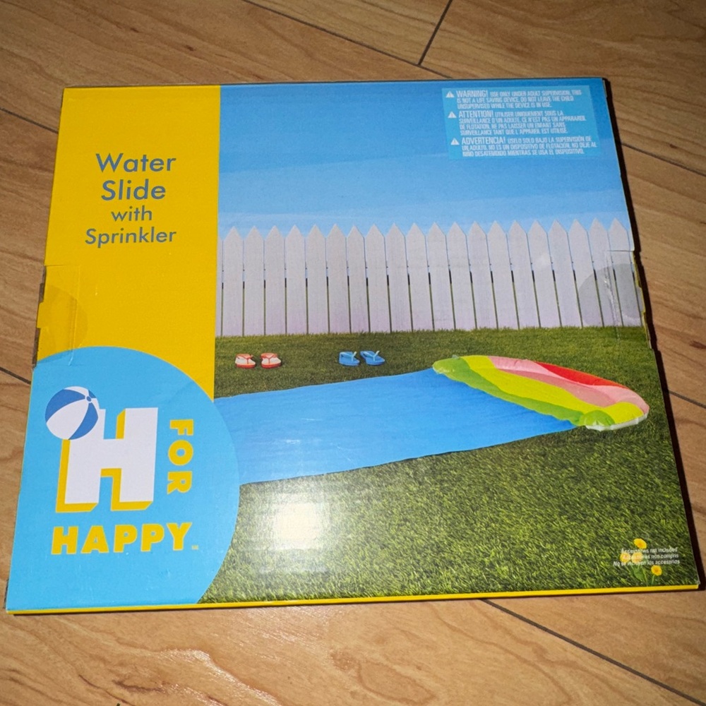 New in box water slide slip & slide w/sprinkler, attaches to any garden hose